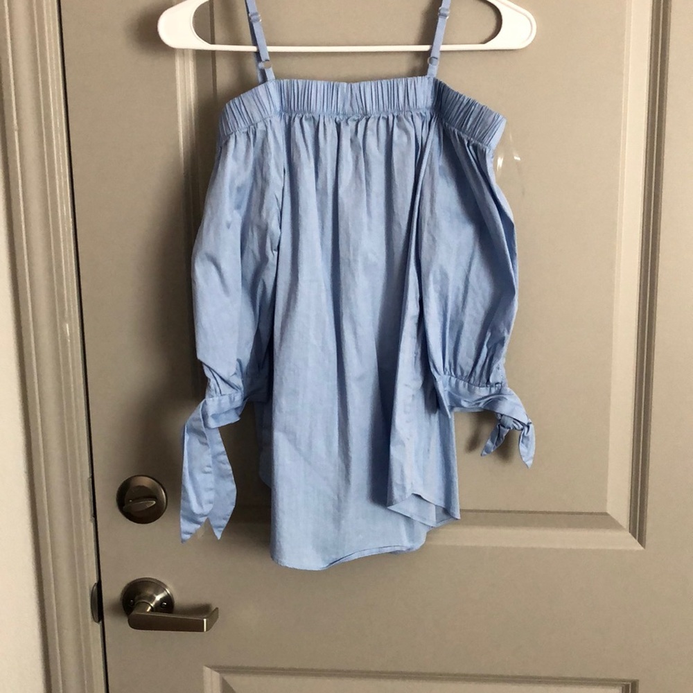 blue off the shoulder shirt